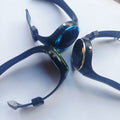 Three round-face watches with black straps and blue, green and gold-coloured face surrounds